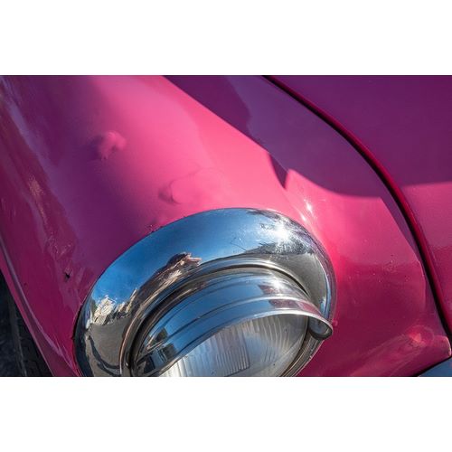 Detail of chrome head light on hot pink classic American Oldsmobile-Havana-Cuba